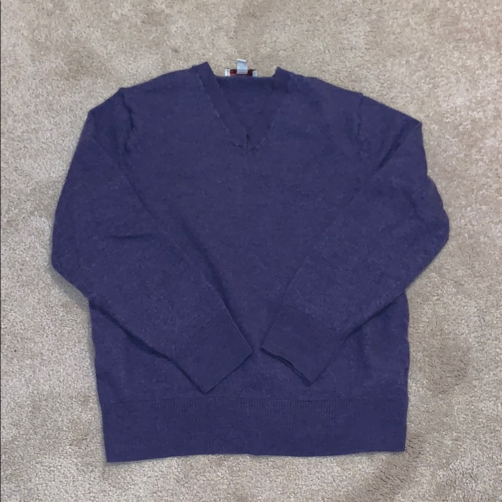 A purple sweater vest by the gap.